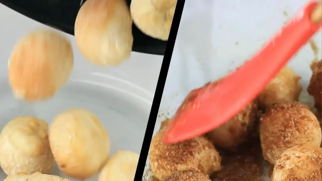 coating the donut holes with sugar and cinnamon