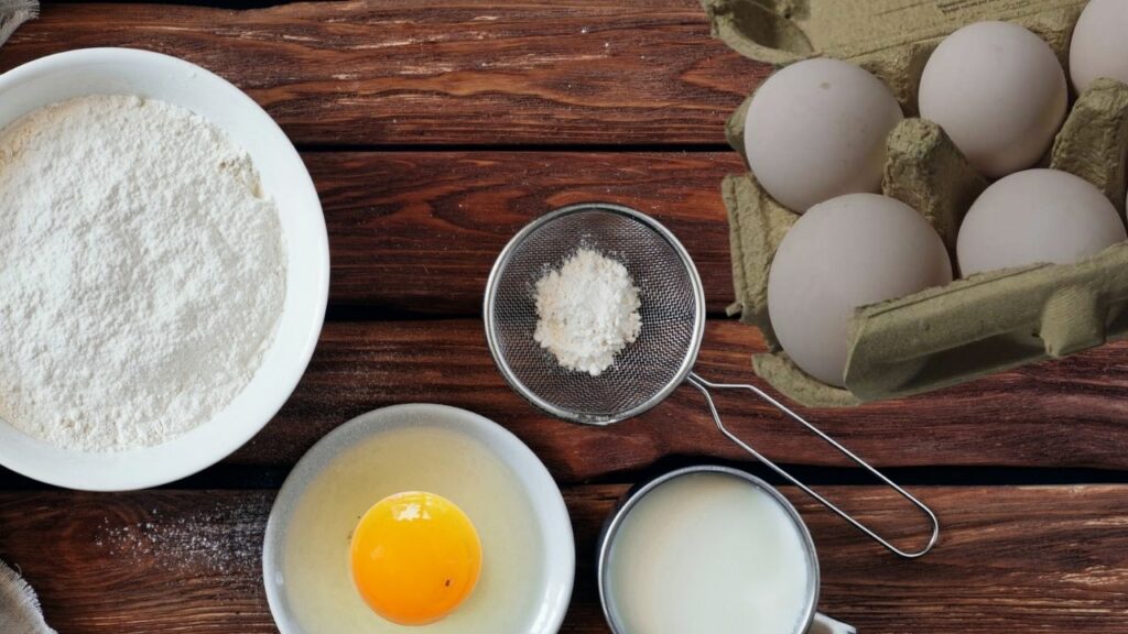 large duck eggs with other baking ingredients on a kitchen table 