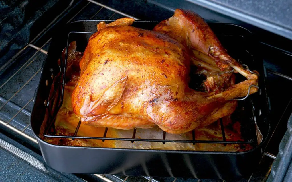 cooking chicken on a roasting pan with a racks