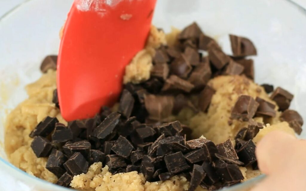 mixing in chocolate chunks