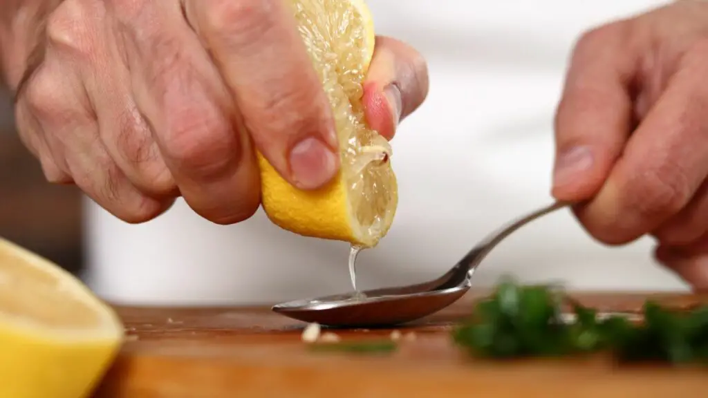 measuring lemon juice for a chicken soup