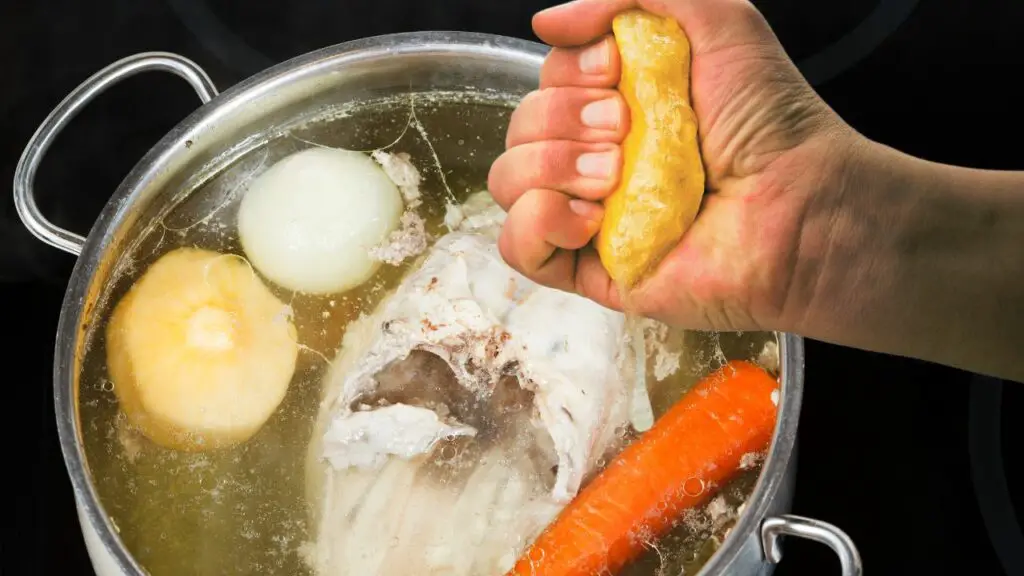 squeezing some lemon juice in chicken soup