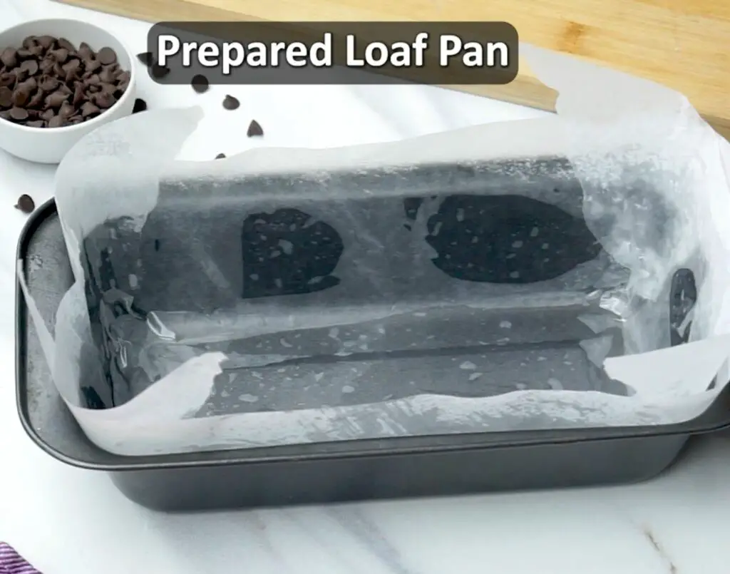 covering the loaf pan with parchment paper