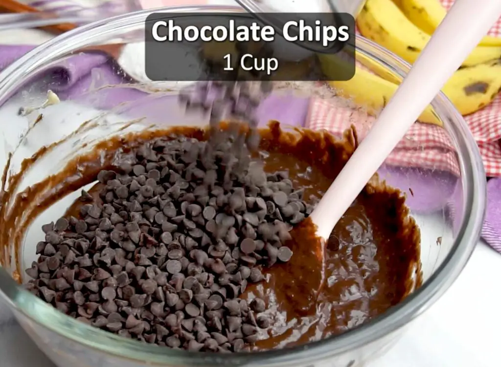 folding the chocolate chips in banana bread batter