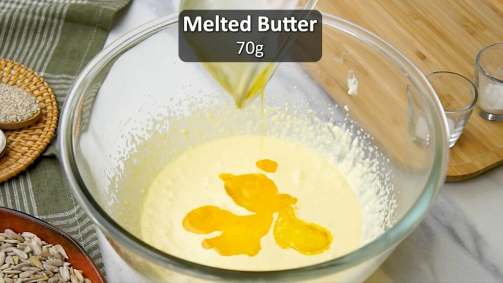 adding half a stick of melted butter