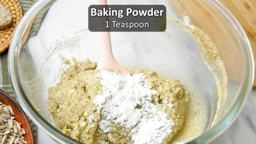 adding baking powder to bread dough