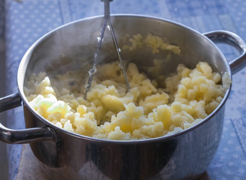 cooking the mashed potatoes more to get rid of the lumps