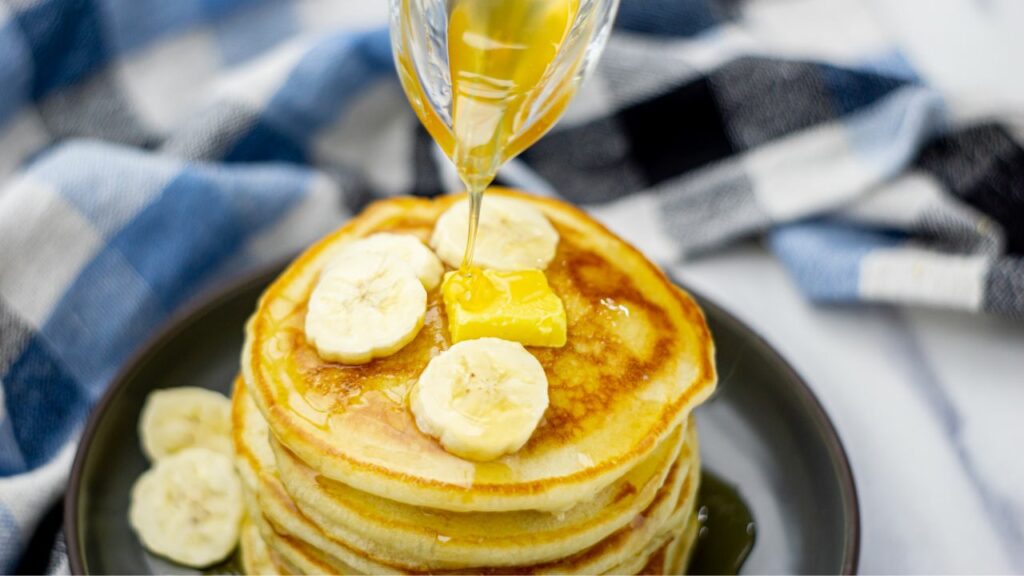 easy fluffy pancake recipe with butter maple syrup and banana