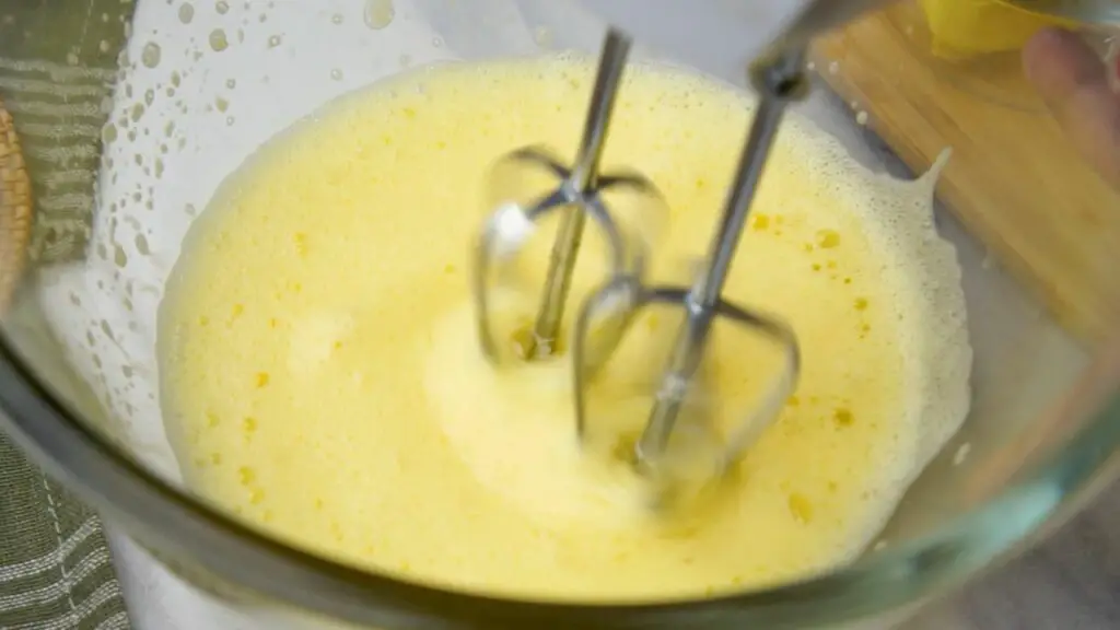 whisking the eggs till soft peak