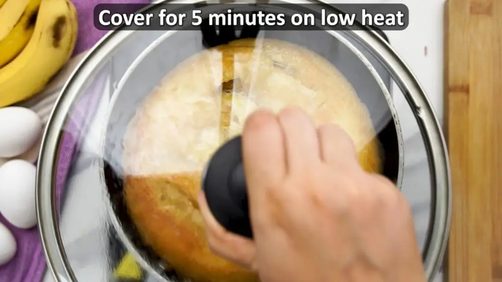 cooking the banana cake on the pan for another 5 minutes