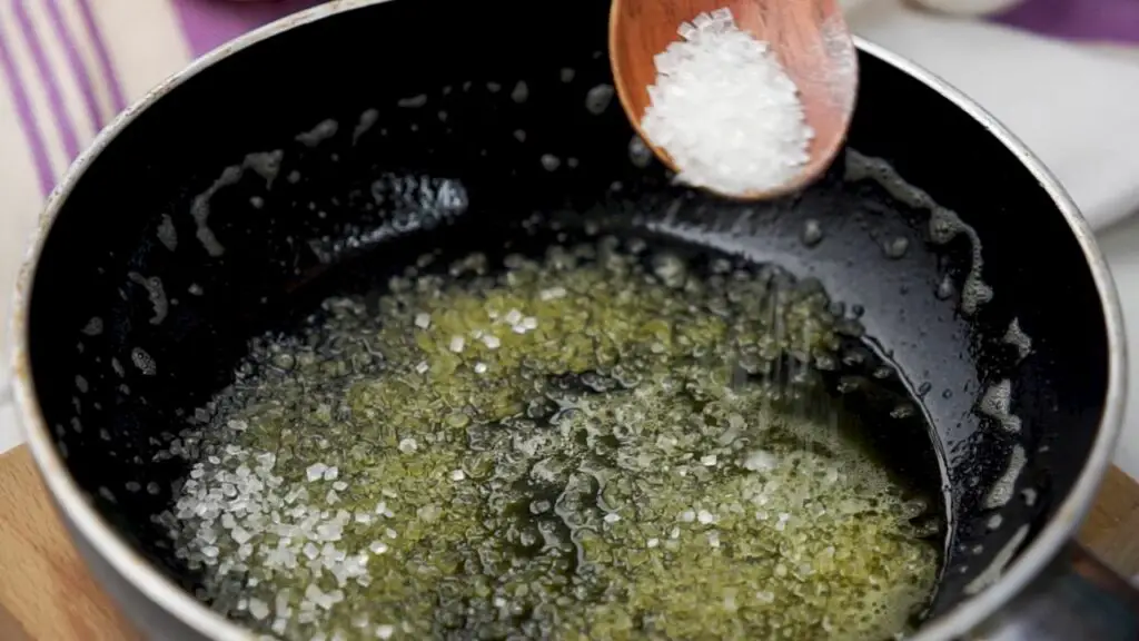 sprinkling some sugar on the bottom of the pan