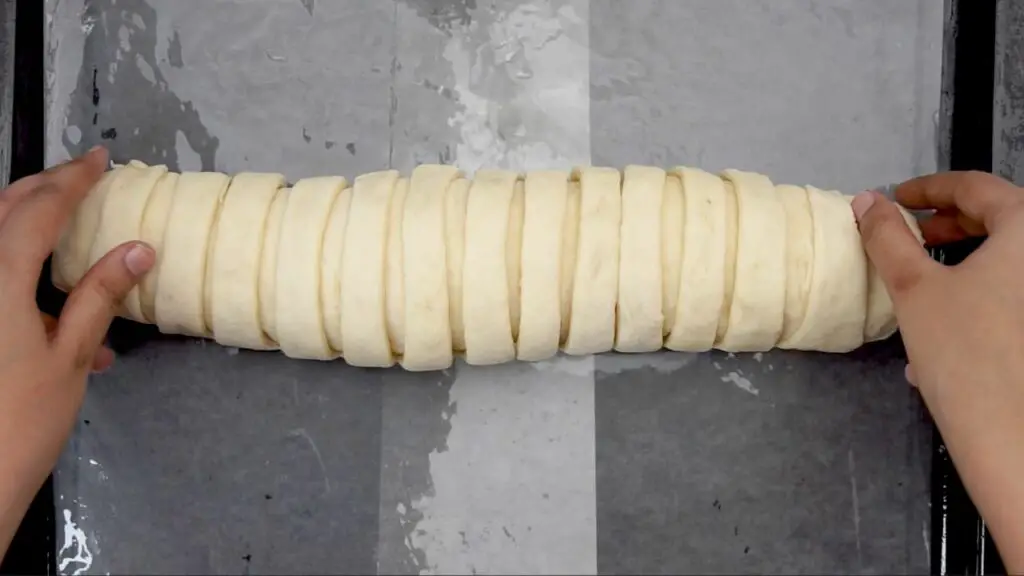 rolled dough on a parchment-lined tray