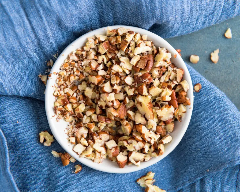 adding crushed nuts to cookies