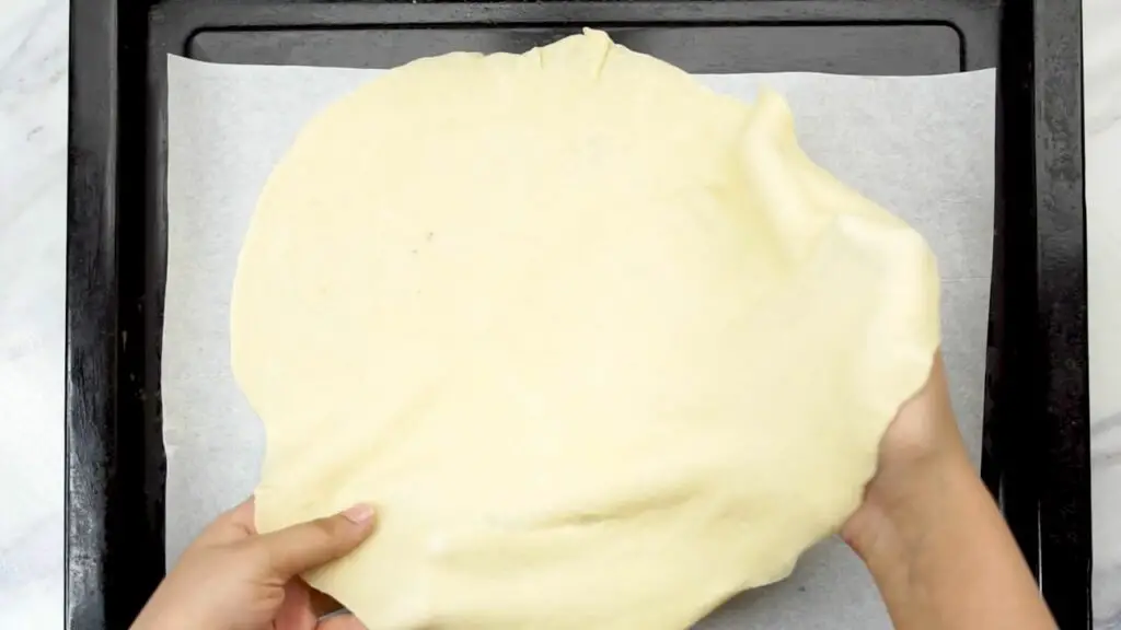 placing the dough onto a baking tray