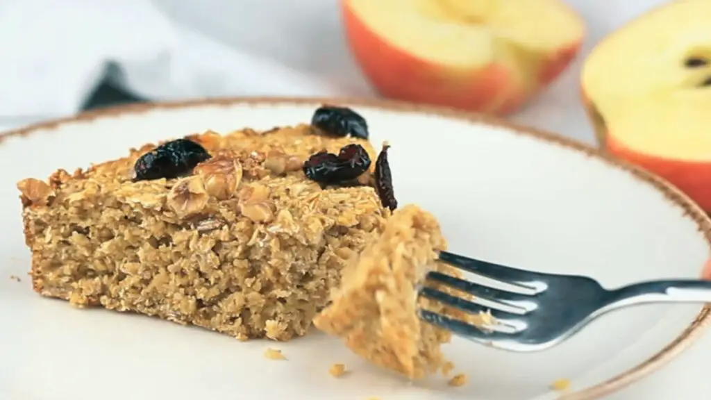 serving the oatmeal apple cake warm streaming out of the oven