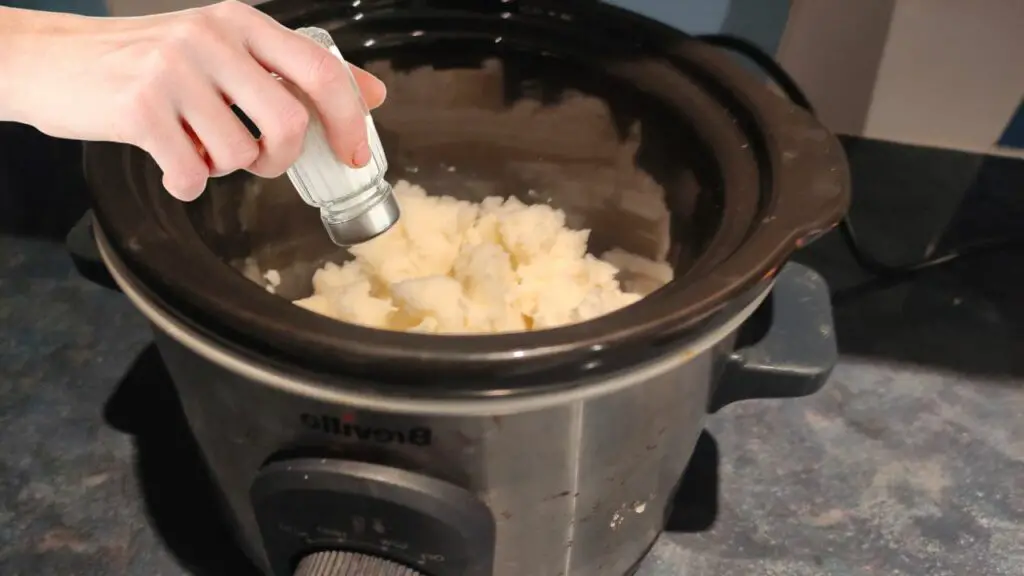 adding salt to mashed potatoes