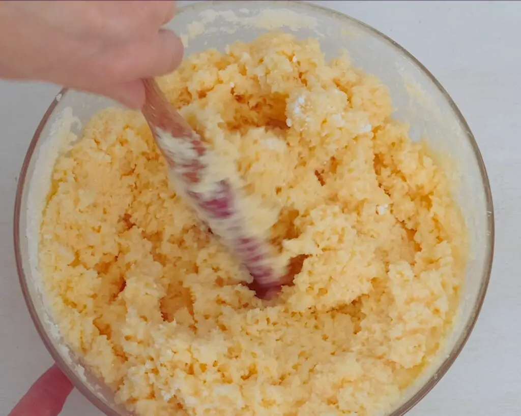 mixing in shredded coconut