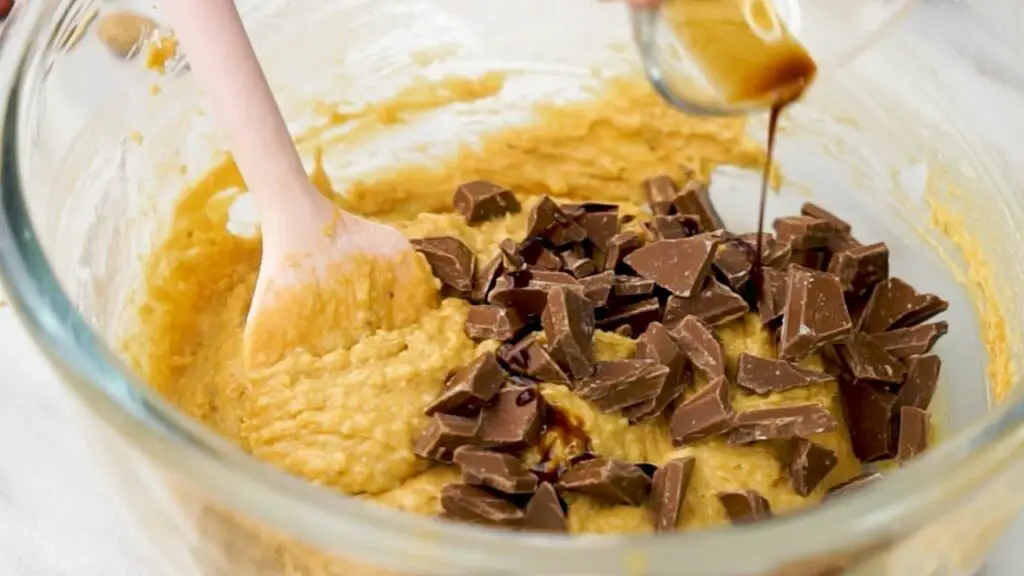 mixing chocolate chips into the batter