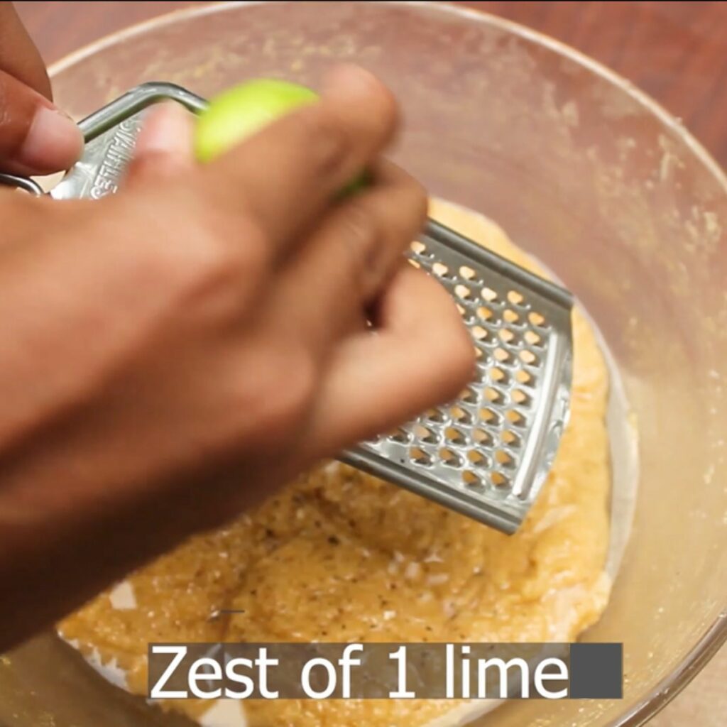 adding the zest of one lime to love cake batter