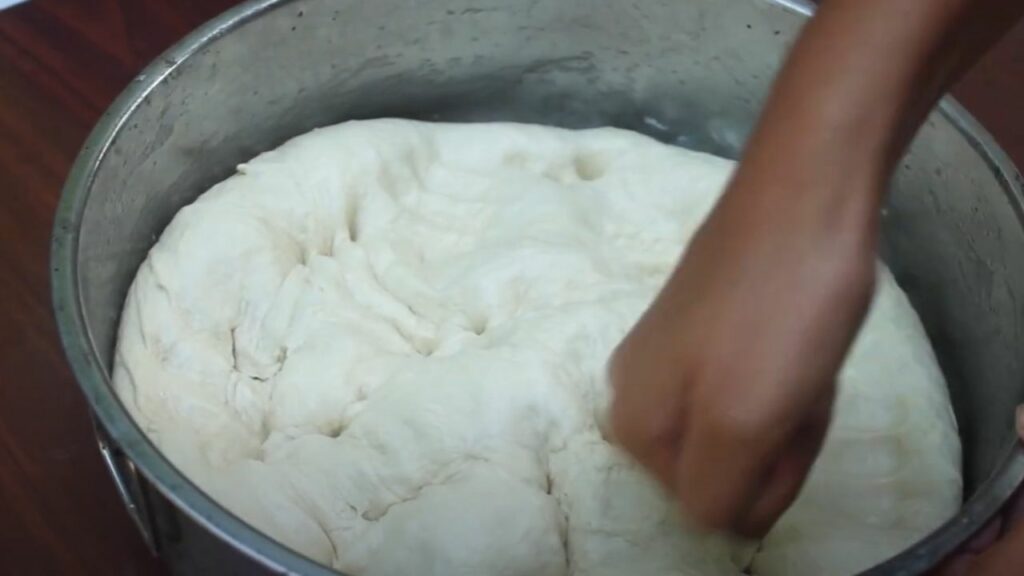 puncing the dough down