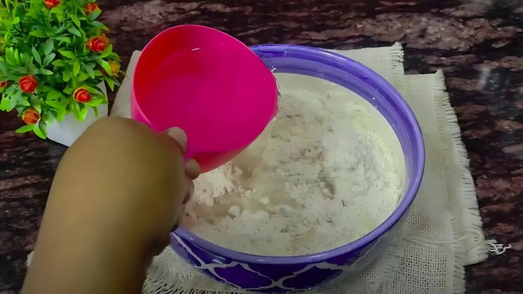 adding water into the dough