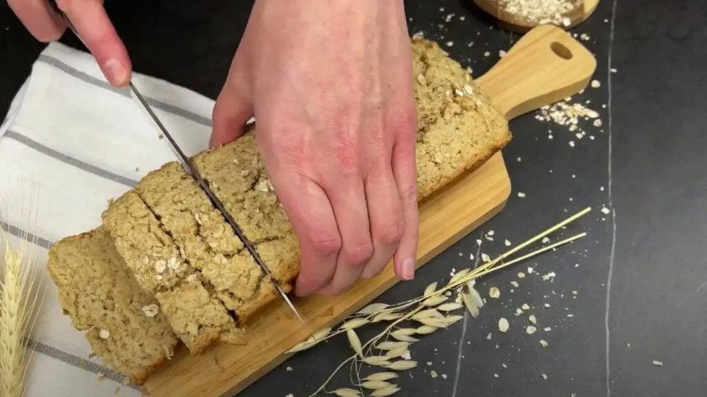 cutting the oat bread