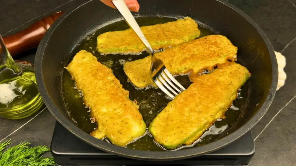 making crispy pan fried zucchini