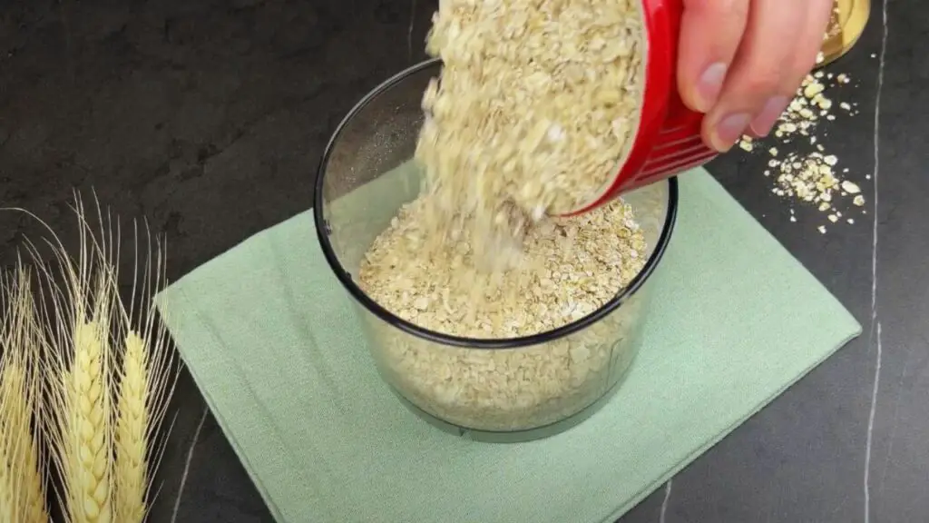 pouring oats into a food container