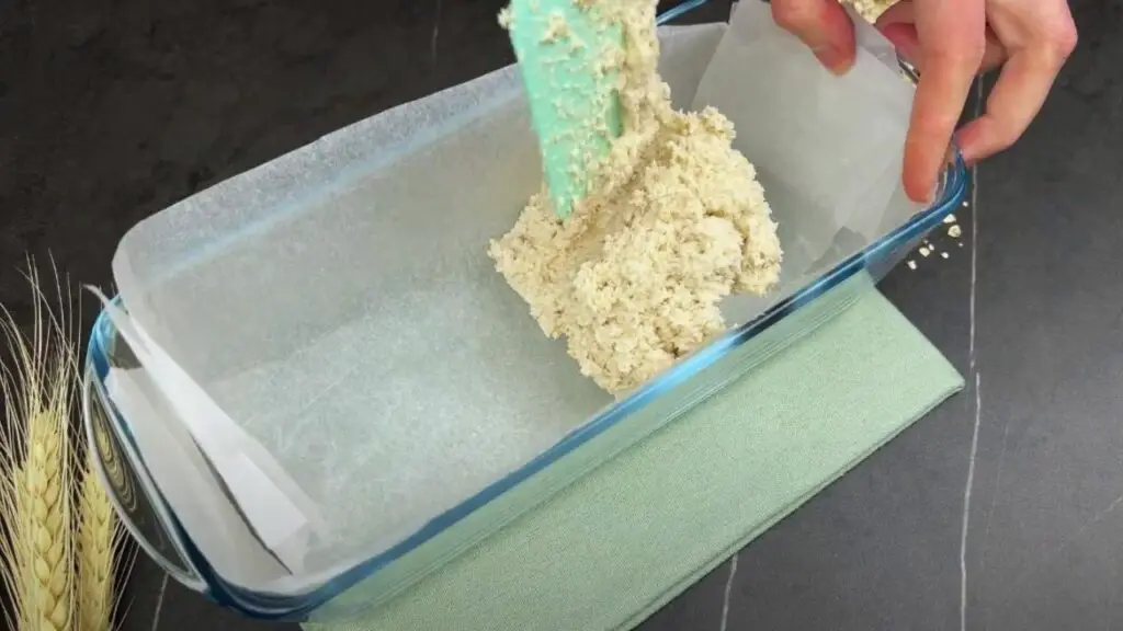 pouring the dough into the loaf pan