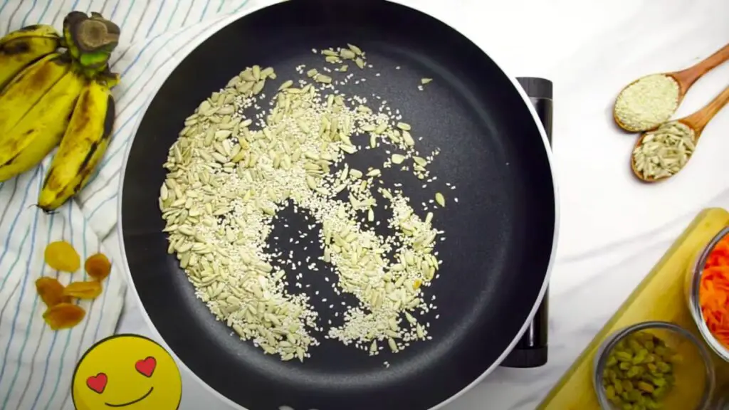 toasting the sunflower and sesame seeds on a pan