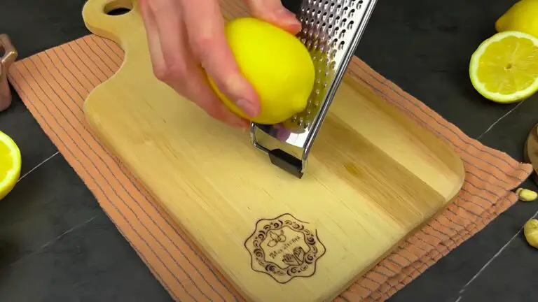 zesting the lemon using a fine grater
