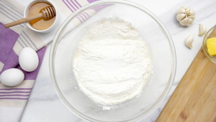 Add bread flour and of salt to the bowl