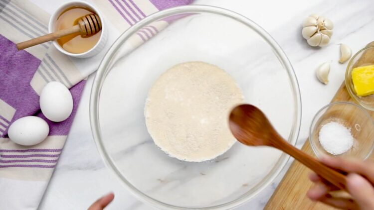 whisk together lukewarm milk, instant dry yeast, and sugar