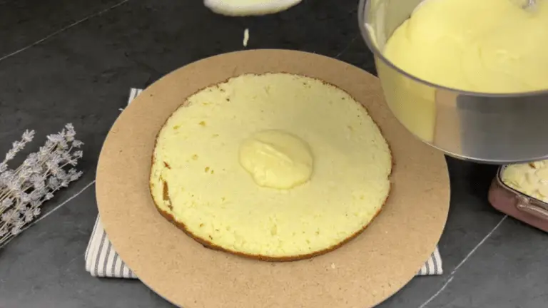 applying the cool glaze into the sliced cake