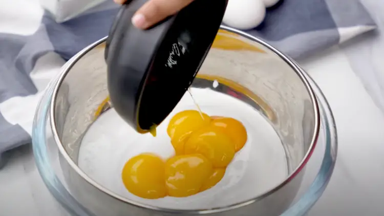 mixing the cream and egg yolks