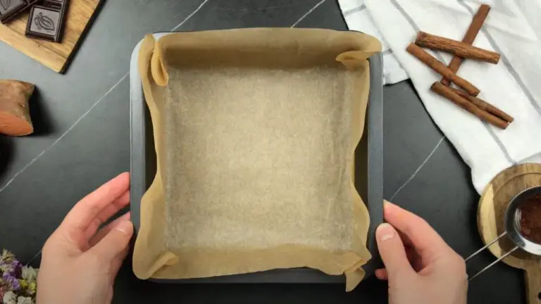 Lining a 9-inch square baking pan with parchment paper