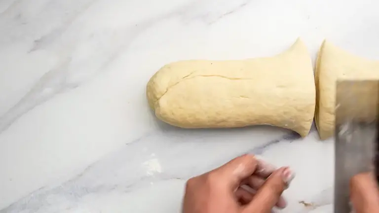 dividing the pita dough for shaping