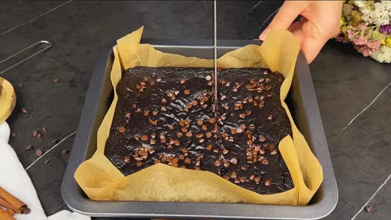 slicing the freshly baked sweet potato brownie to serve