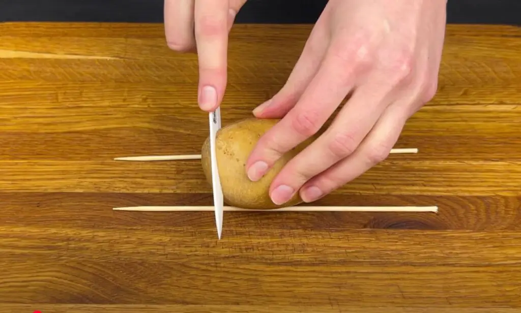  A simple hack using chopsticks ensures perfectly even slices for the crispiest potatoes you'll ever make.