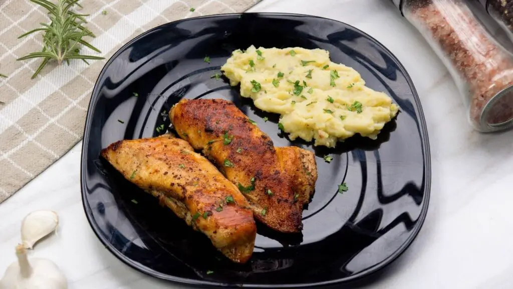 chicken breast in a pan with butter