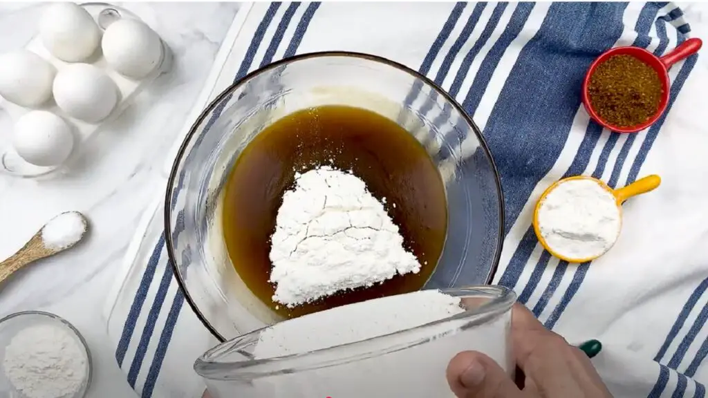 adding dry ingredients to wet ingredients