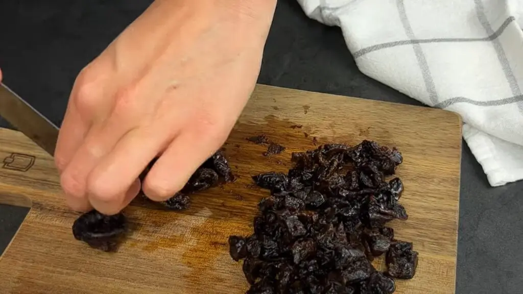 chopping of prunes to small pieces