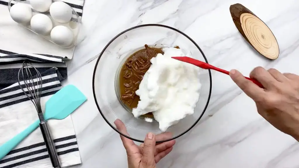 adding egg white to melted chocolate