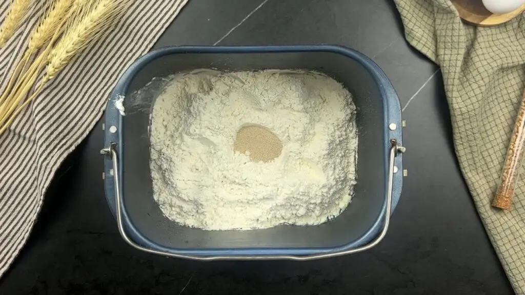 adding of flour and yeast at the center