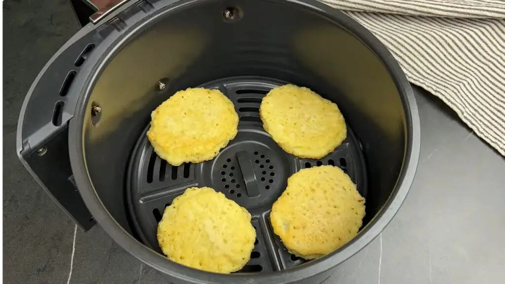 placing hash brown into air fryer