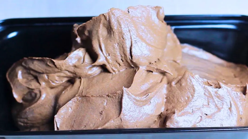 Pouring the chocolate mixture into a loaf pan