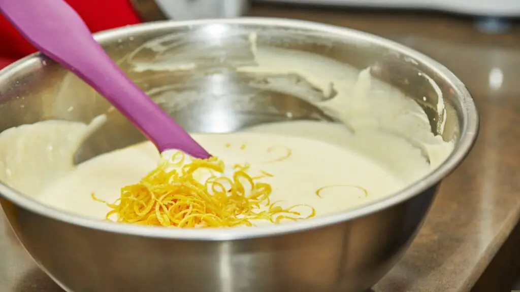 adding lemon zest to cake batter