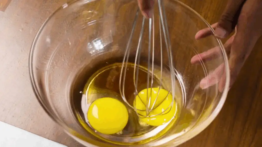 mixing the wet ingredients of moist banana bread