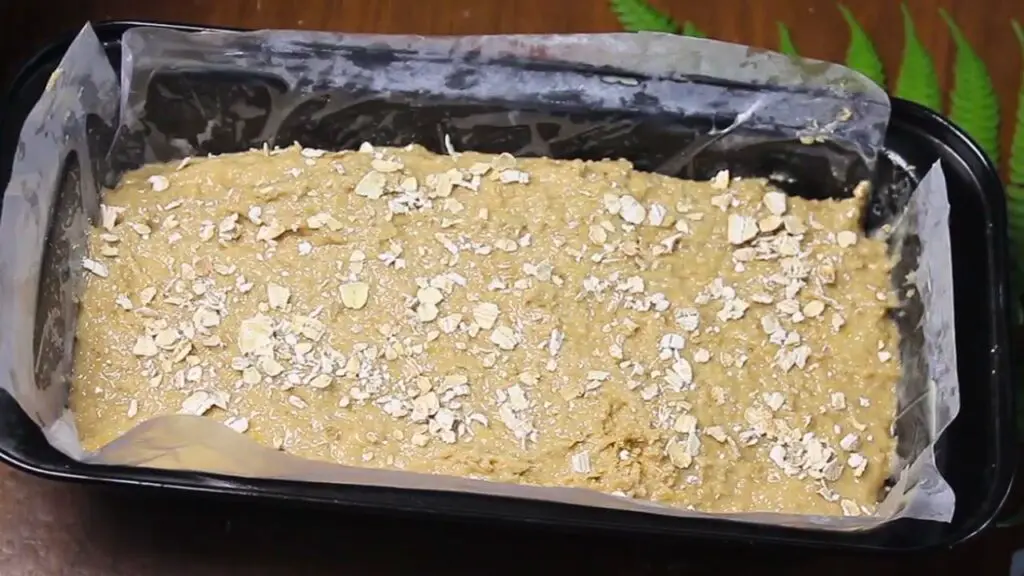 pour the batter into pan and add few oats