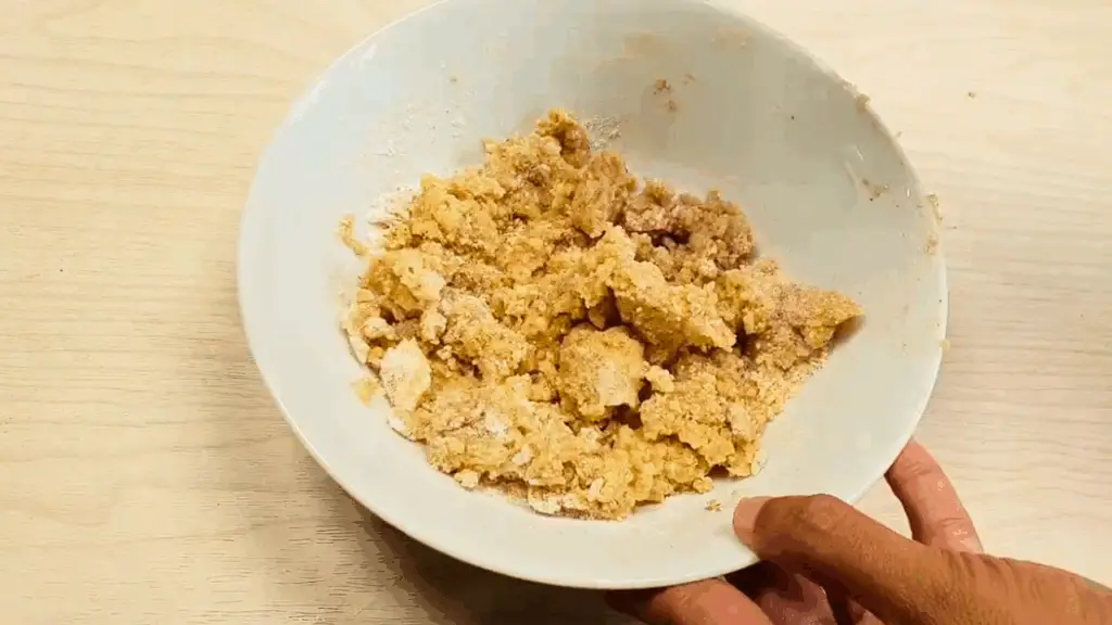 preparing the crumble topping for apple crumb bake